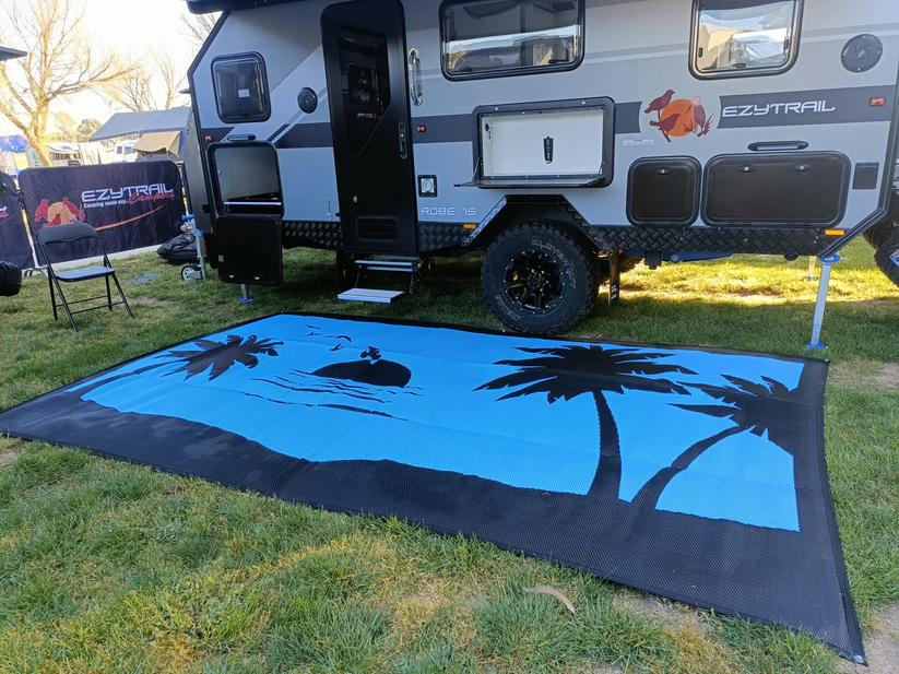Mooving Mat coast design set up beside an EzyTrail caravan